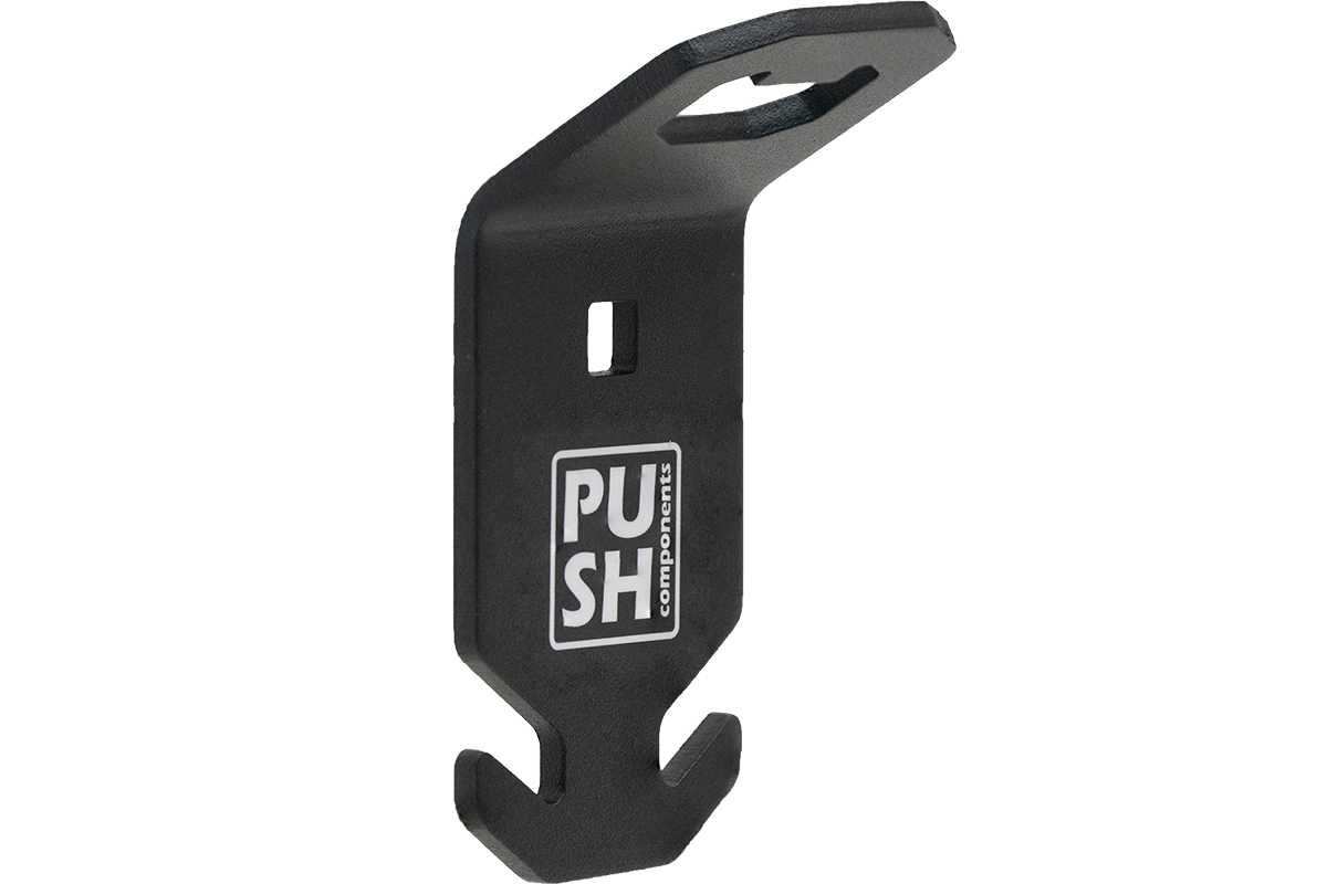 This picture shows the product PUSHrack bottle opener called BLOP, with which you can not only open your bottle but also hang a bin bag on the hook provided on the bottle opener.