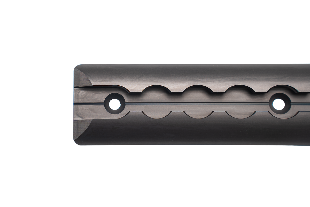 Close-up of a PUSHrack Airline Rail/L-Tracks with flattened ends and round hole profile