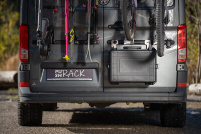PUSHrack box mounted on a campervan with Room Extender below two bicycles on the rear doors, box closed